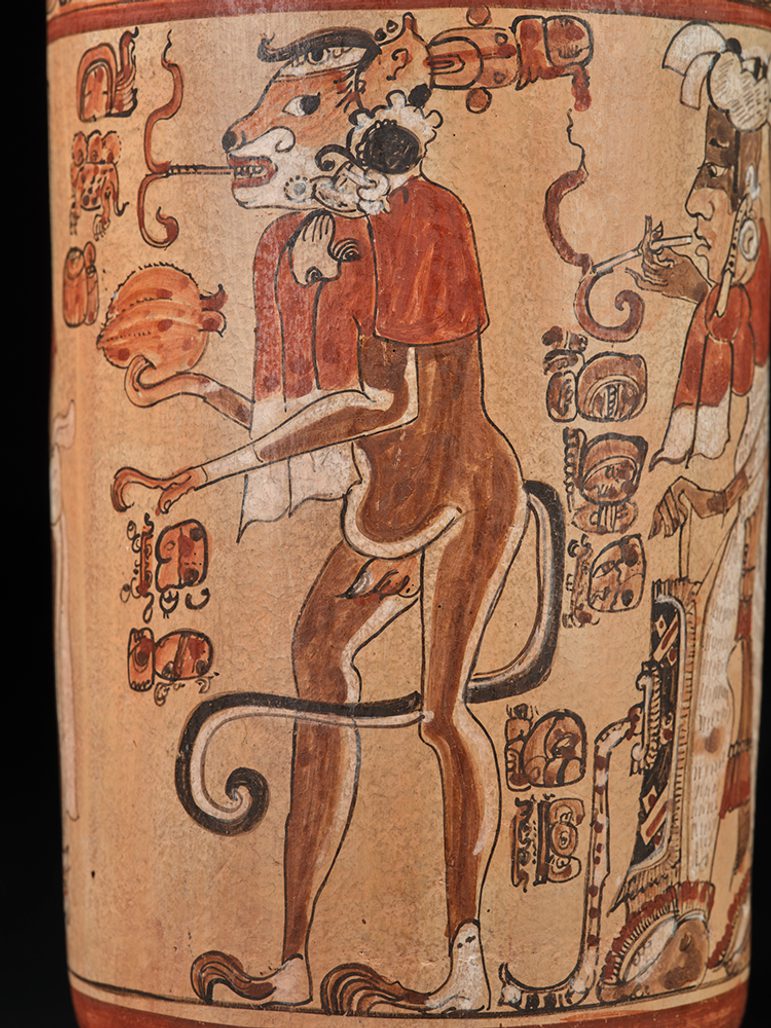 Ancient Mayan vase depicting a detailed illustration of a smoking monkey and human figures, adorned with intricate glyphs and traditional motifs.