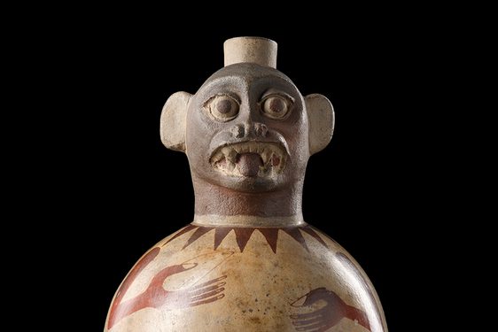 A rounded jug with a monkey's face at the top
