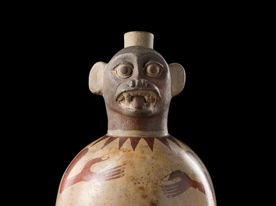 A rounded jug with a monkey's face at the top