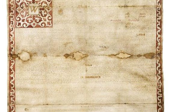 A yellow worn sheet of paper, with watermarks in the middle of the document.  Red border decorated with repeated yellow pattern, that also frames the letter 'W'.