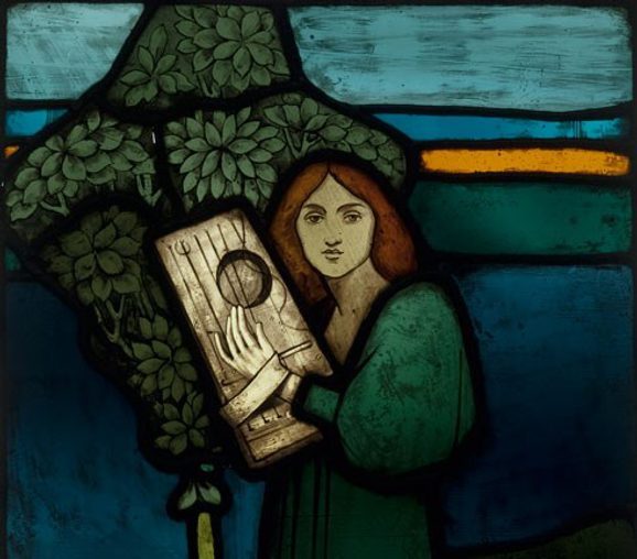 A coloured glass panel depicting a woman playing a string instrument