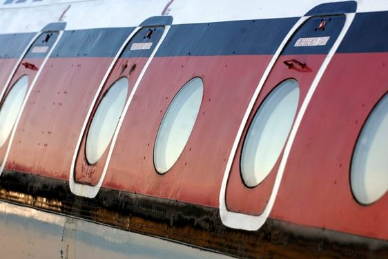 Close up view of the outside of the Comet 4C aircraft, focusing on the cabin windows.
