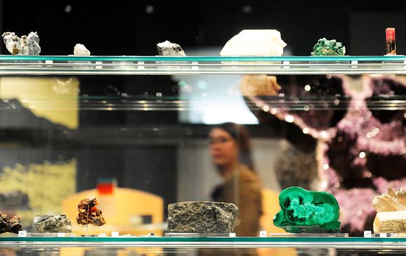 Close up of geological samples in a display case in a museum gallery.