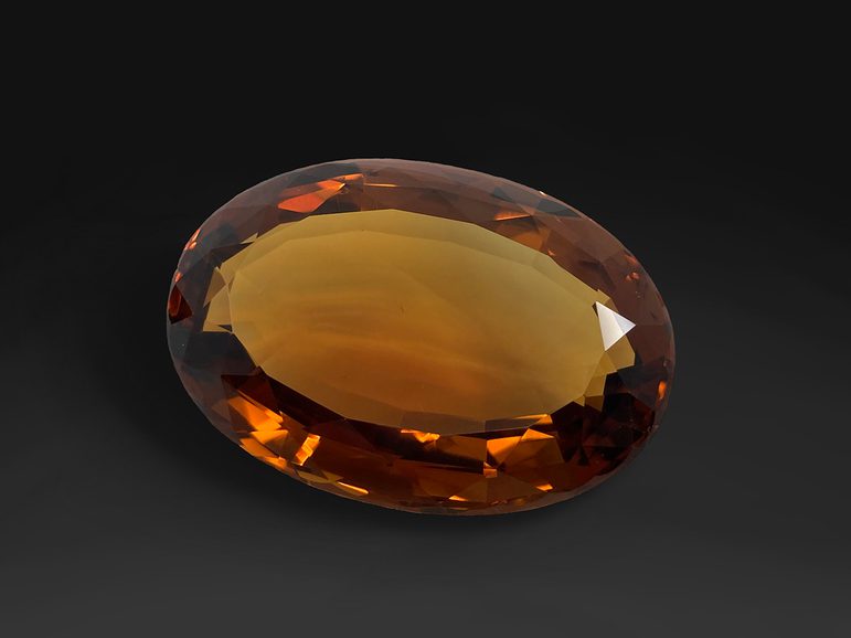 A clear faceted orange gem