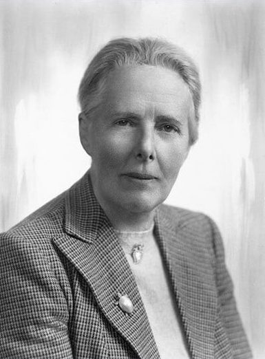 Portrait of a woman with short hair wearing a blazer