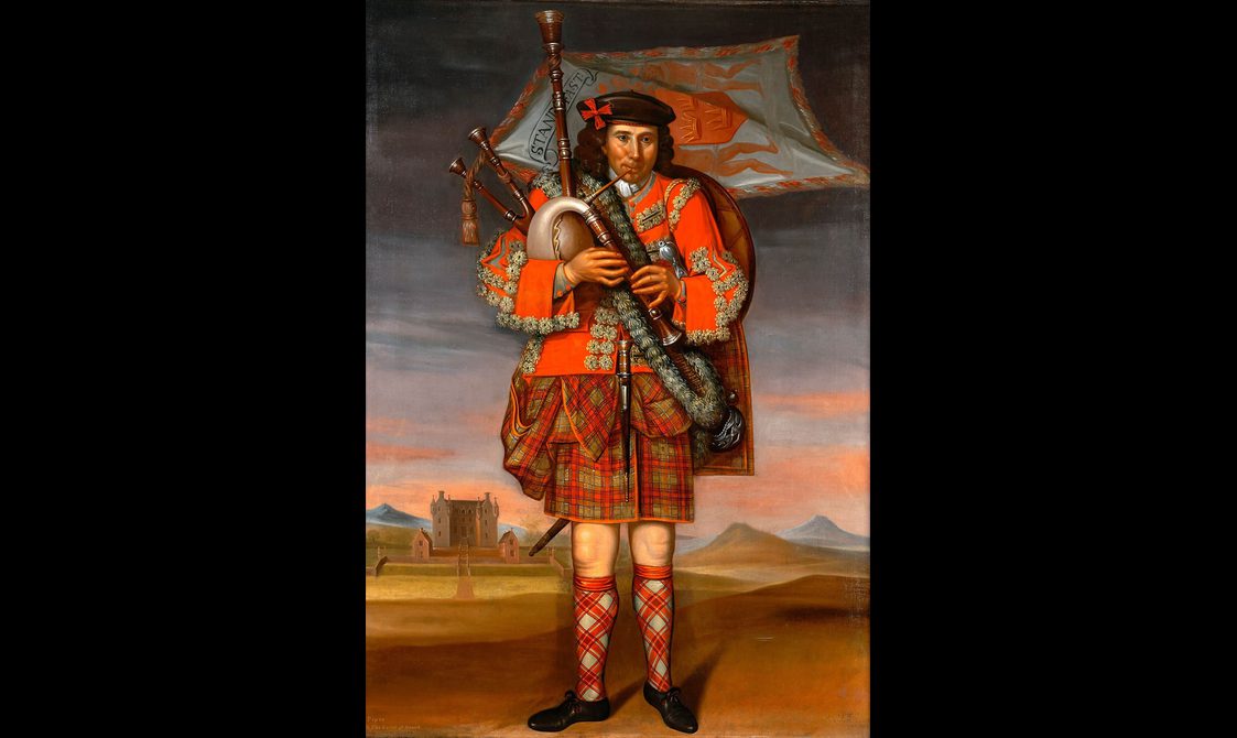 Painting of a man playing the bagpipes in the countryside. He is wearing a uniform of red tartan.