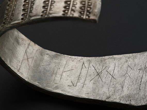 A close up of the runic inscription on the inside of the Galloway Hoard silver arm ring.