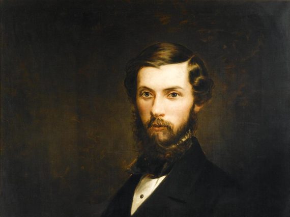 A painting of a man looking outward with short brown hair and a beard wearing a white shirt and black jacket
