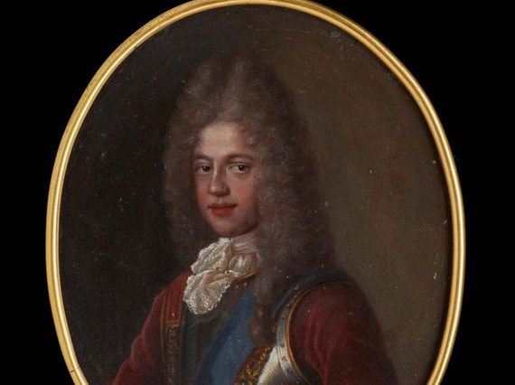 An oval-shaped miniature with gilded edges. A man wearing a long pointy grey curly wig, a red jacket, iron armor, white ruffled collar and a blue ribbon over left shoulder.