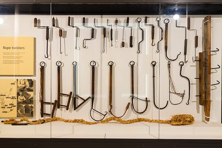 Rope twisters exhibition display on white background at the National Museum of Rural Life.