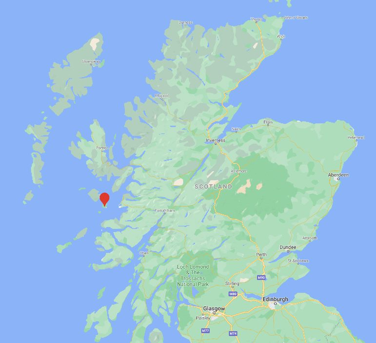 A map of Scotland with a red location pin on the Isle of Eigg