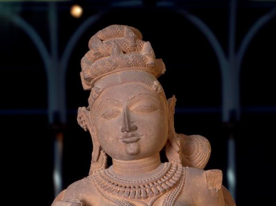 Figure of a Surasundari or divine beauty, wearing elaborate jewellery and with dressed hair, carved sandstone.