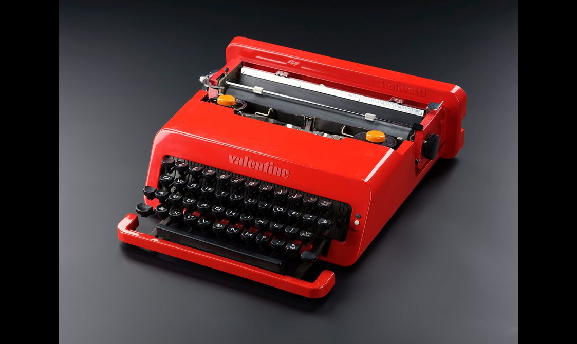 A red Olivetti typwriter.