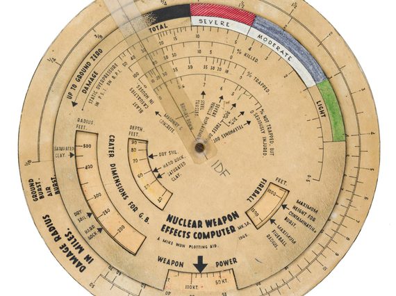 Round paper dial with different measurement and colour markings all around. There are small windows in the top layer to reveal different marking when the wheel is rotated.