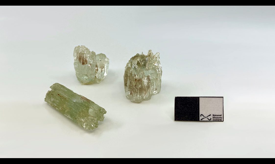 Three light green gem stones