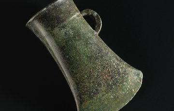 A weathered bronze axehead