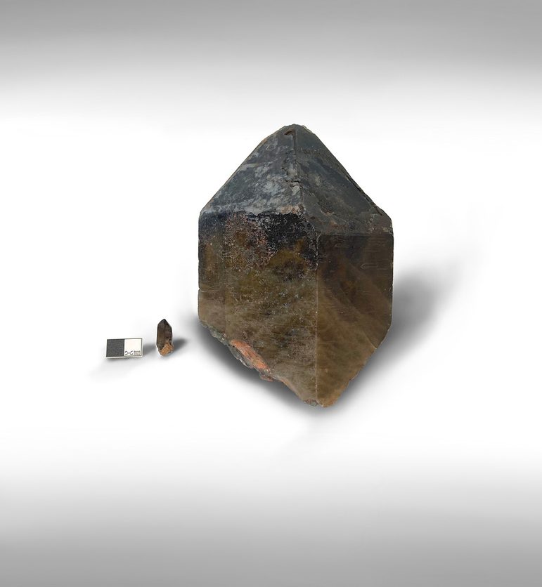 A large and small opaque brown stone