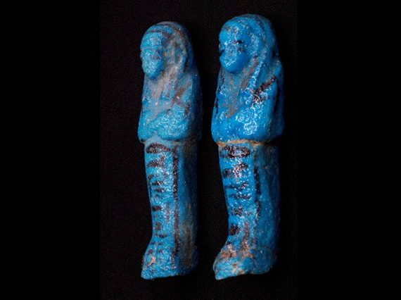 Two blue statuettes of sarcophaguses