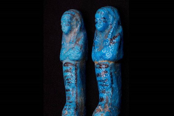 Two blue statuettes of sarcophaguses