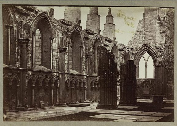 A black and white image of a partially ruined abbey.