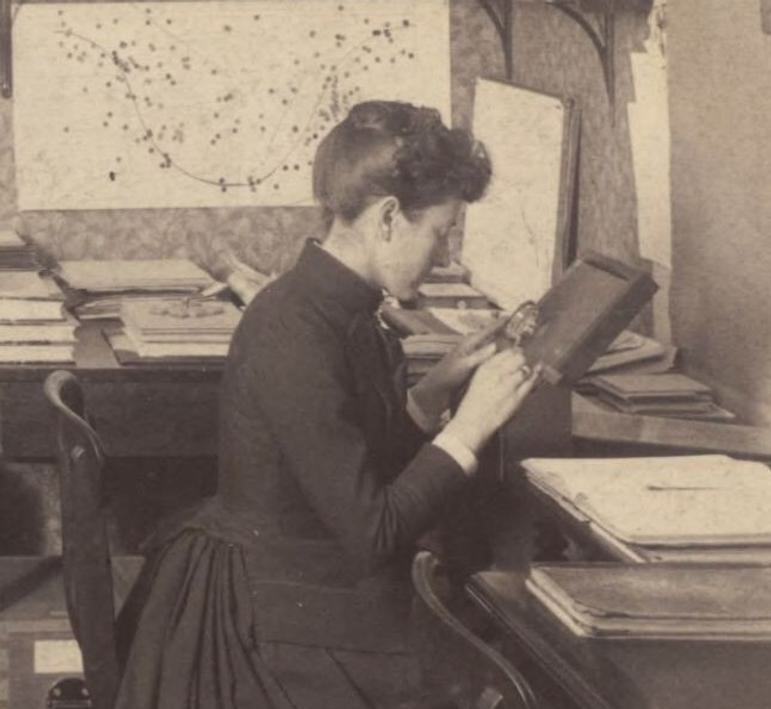 Photography of 19th century woman examining a star plate