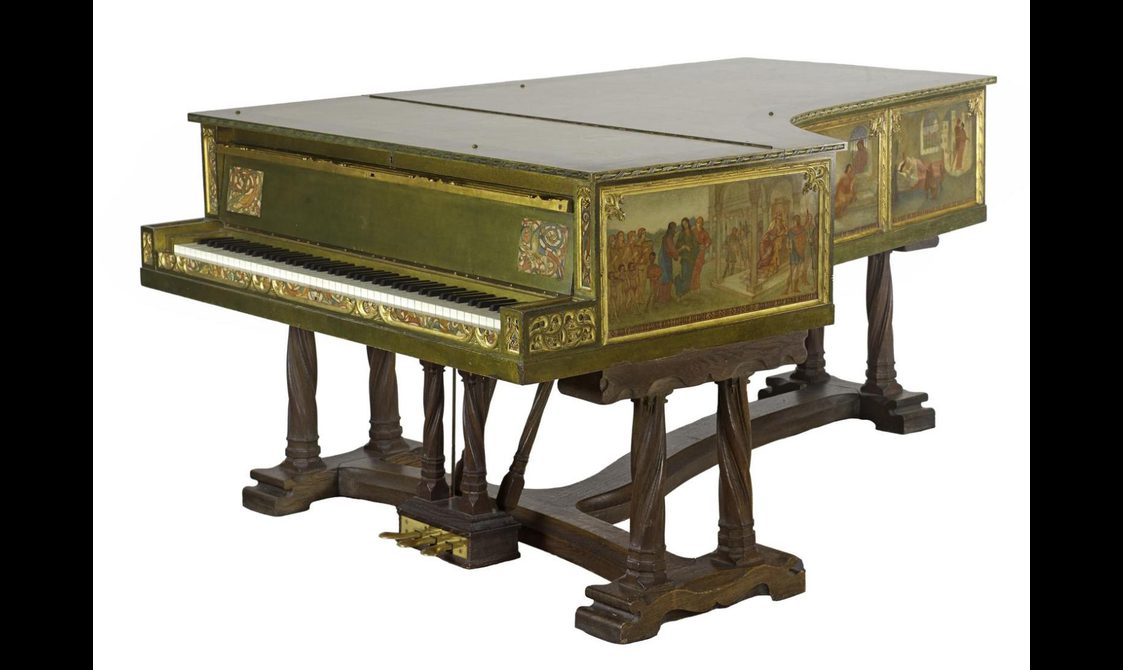 A piano with surfaces painted in muted colours depicting mythical scenes.