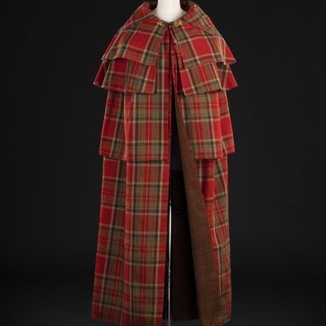 A four layer woman's cloak in bright red tartan colours