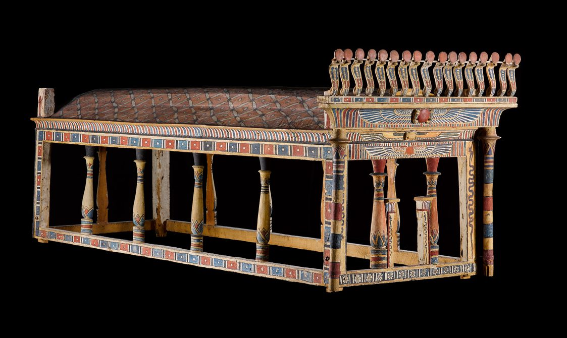 A decorated wooden canaopy structure from Ancient Egypt.
