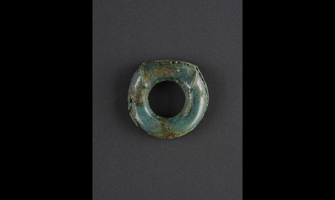 A small round ring of bronze.