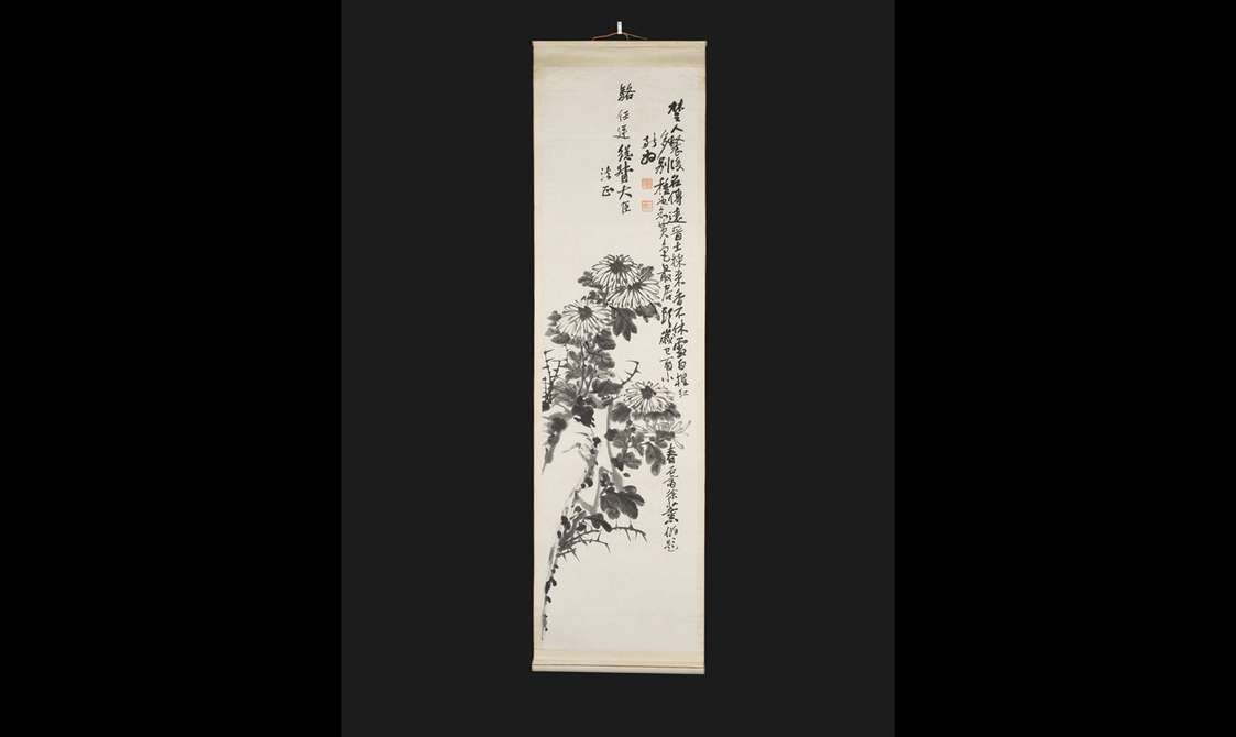 Long rectangular hanging scroll painting depicting a rock and chrysanthemums