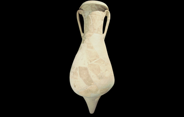 Light yellow pot standing upright, with a triangular bulb at the bottom and tapering toward the top with slim handles either side.